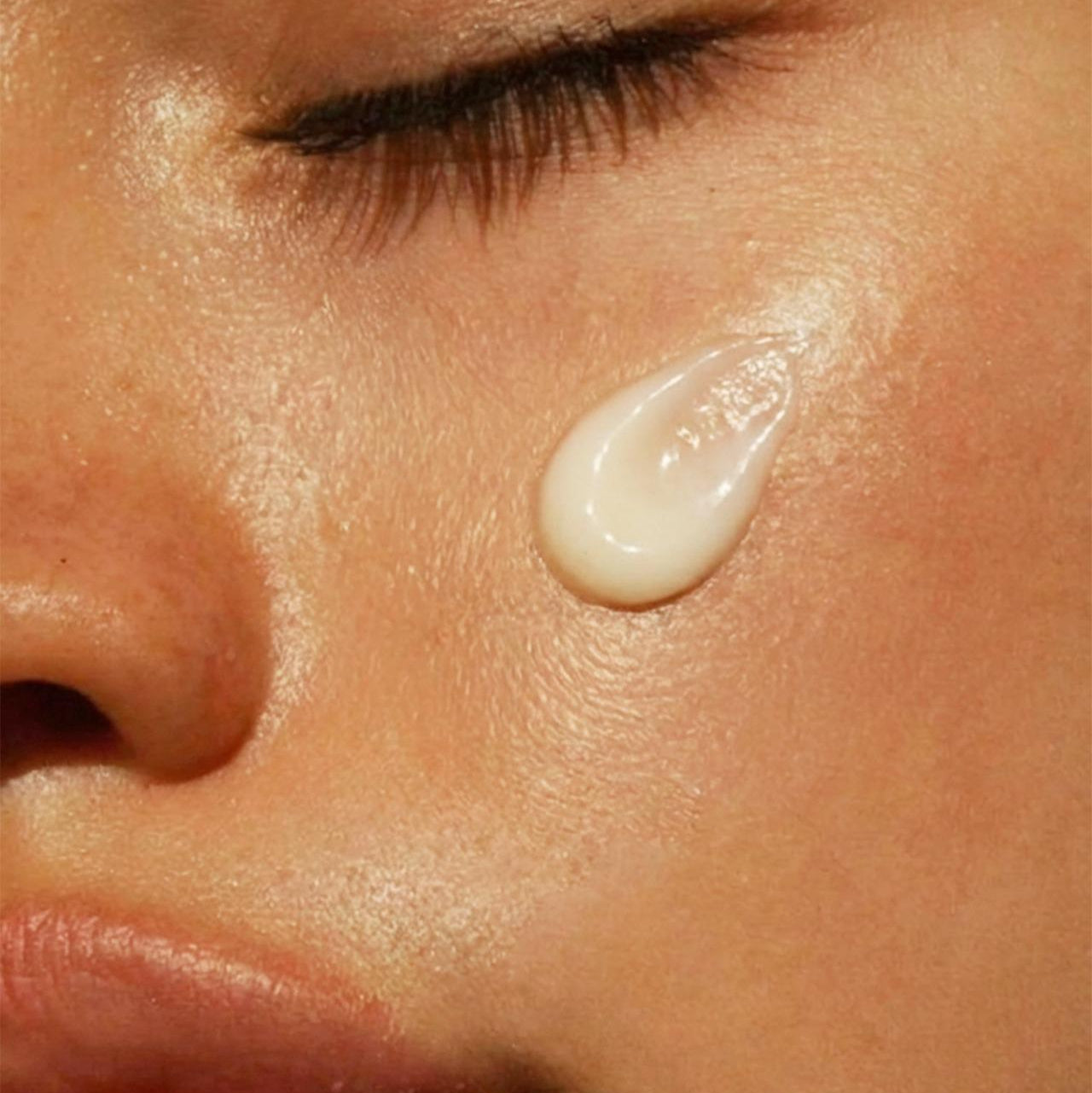 Close-up of a droplet of cream on skin