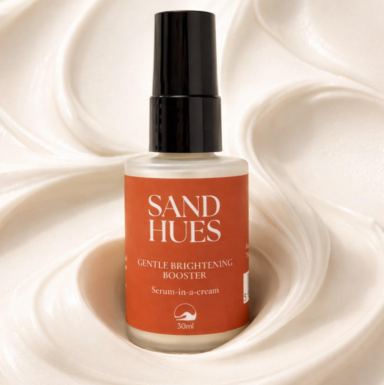 Sand Hues serum bottle on a swirling cream background
